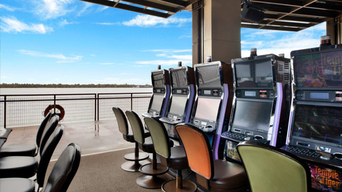 view past slot machines to the Mississippi River from L'Auberge Baton Rouge's smoking/gaming area, Riverbend Terrace