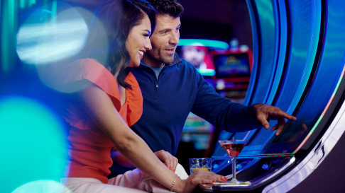Man and woman at slot machine